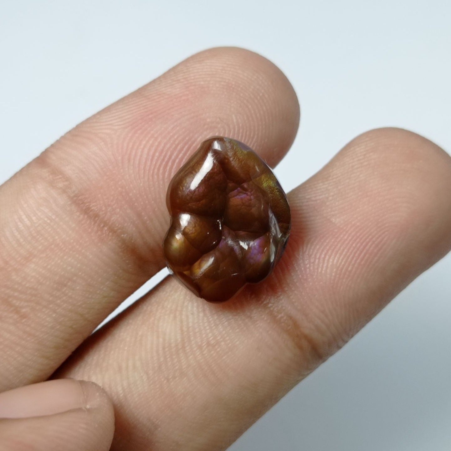 10.5ct Carved Purple Fire Agate - Dimensions 17x13x5mm