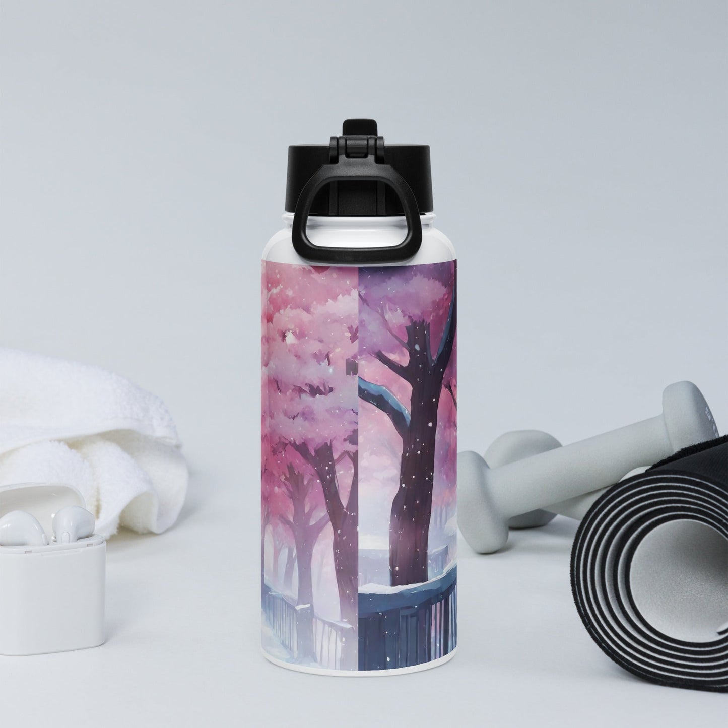 Stainless steel water bottle with a straw lid