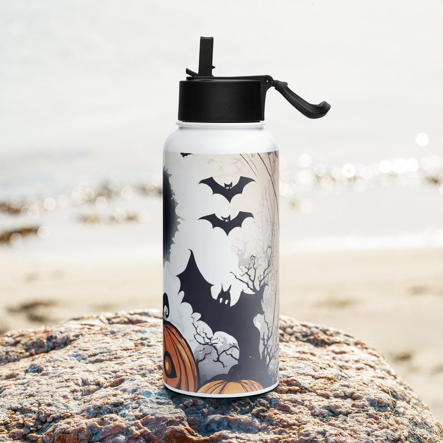 Stainless steel water bottle with a straw lid