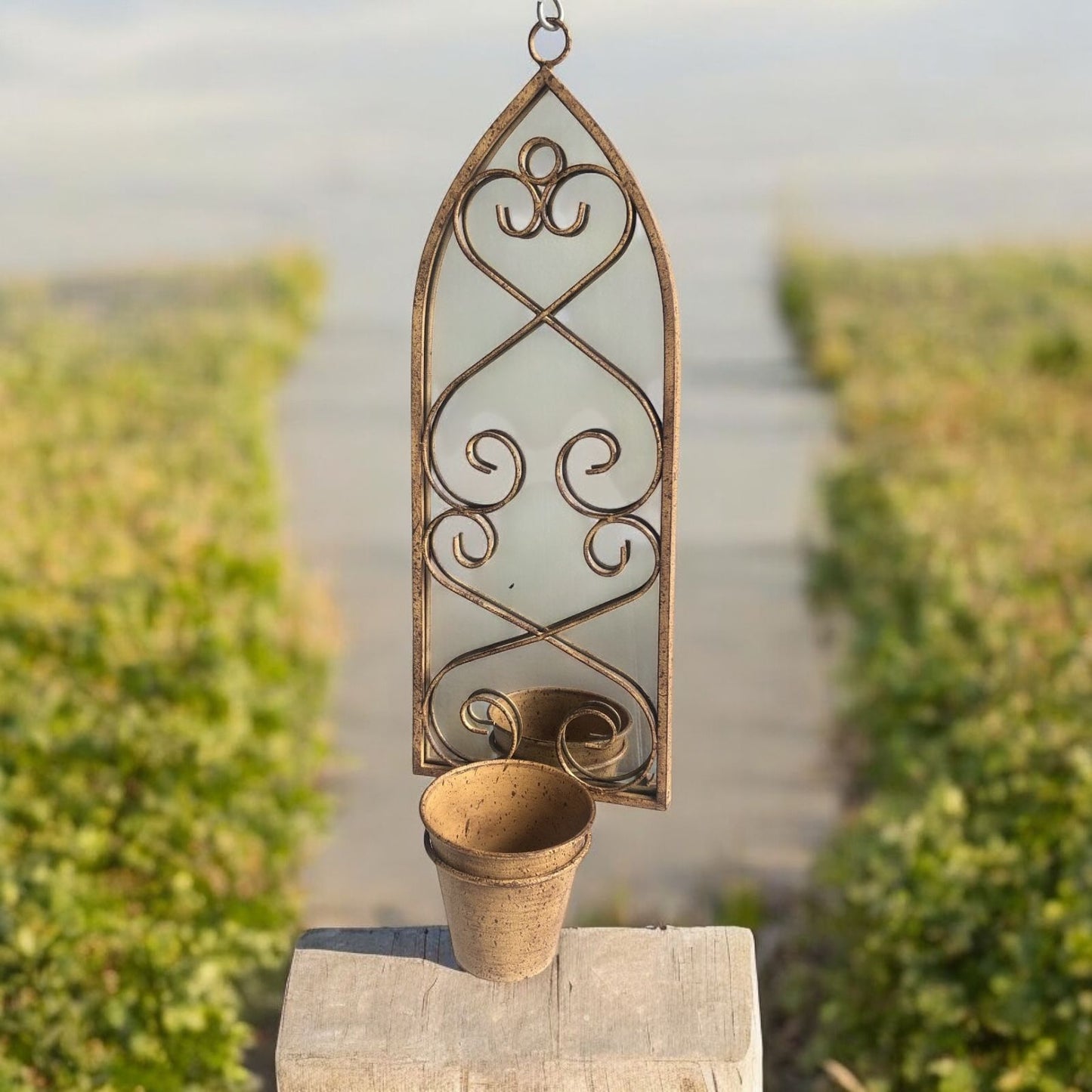 56cm RUSTY WALL MIRROR WITH SINGLE PLANTER