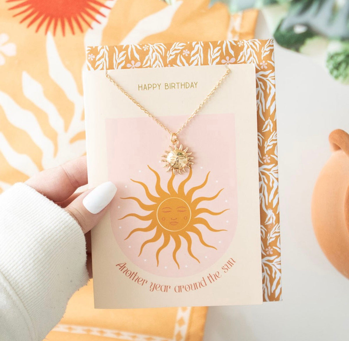 Sun necklace on birthday card
