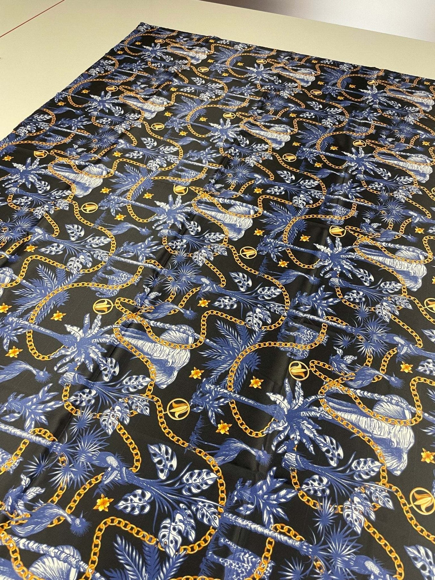 Black and Blue Tropical Fabric with Gold Chains  Fabric by Metre