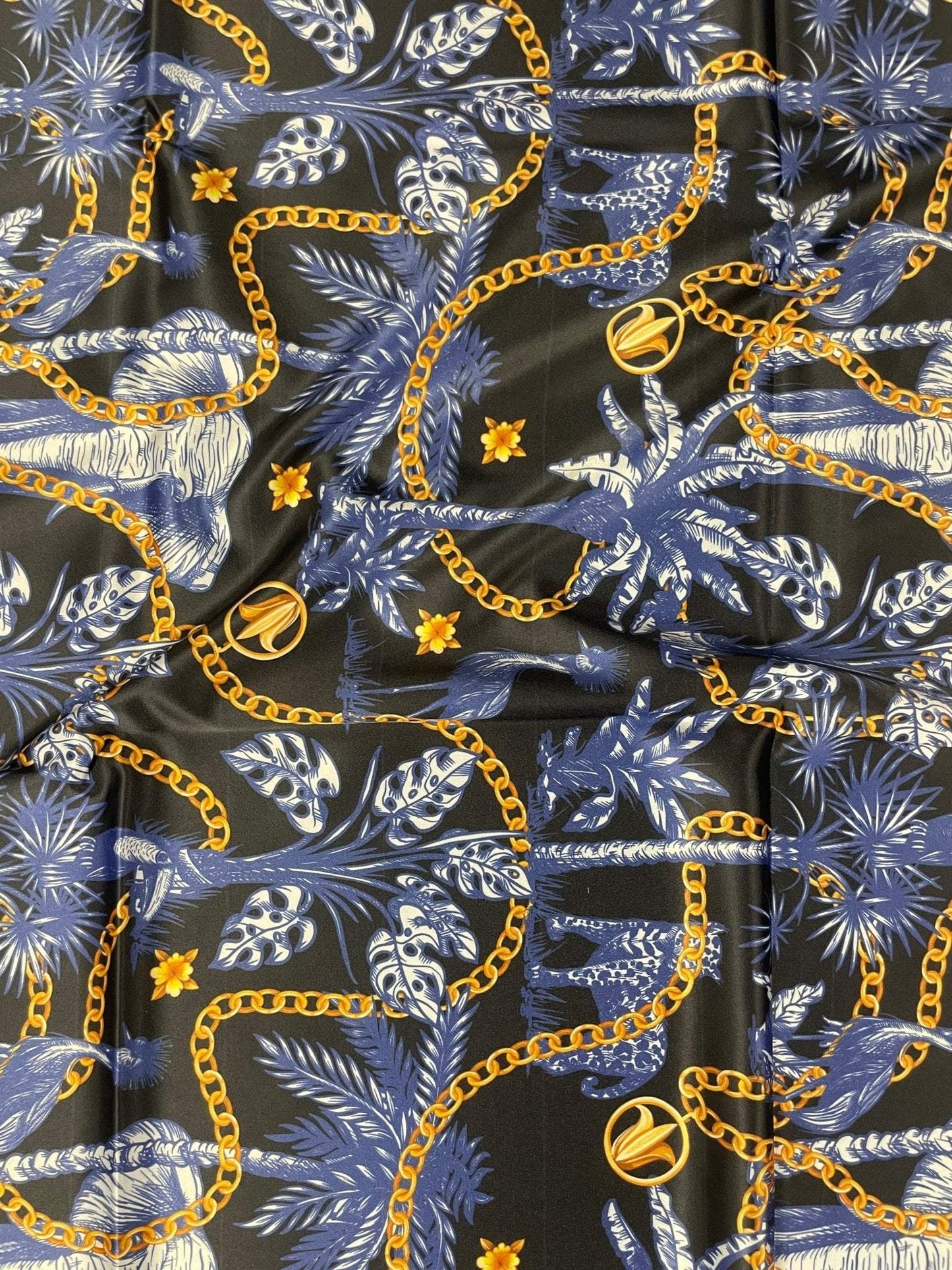 Black and Blue Tropical Fabric with Gold Chains  Fabric by Metre
