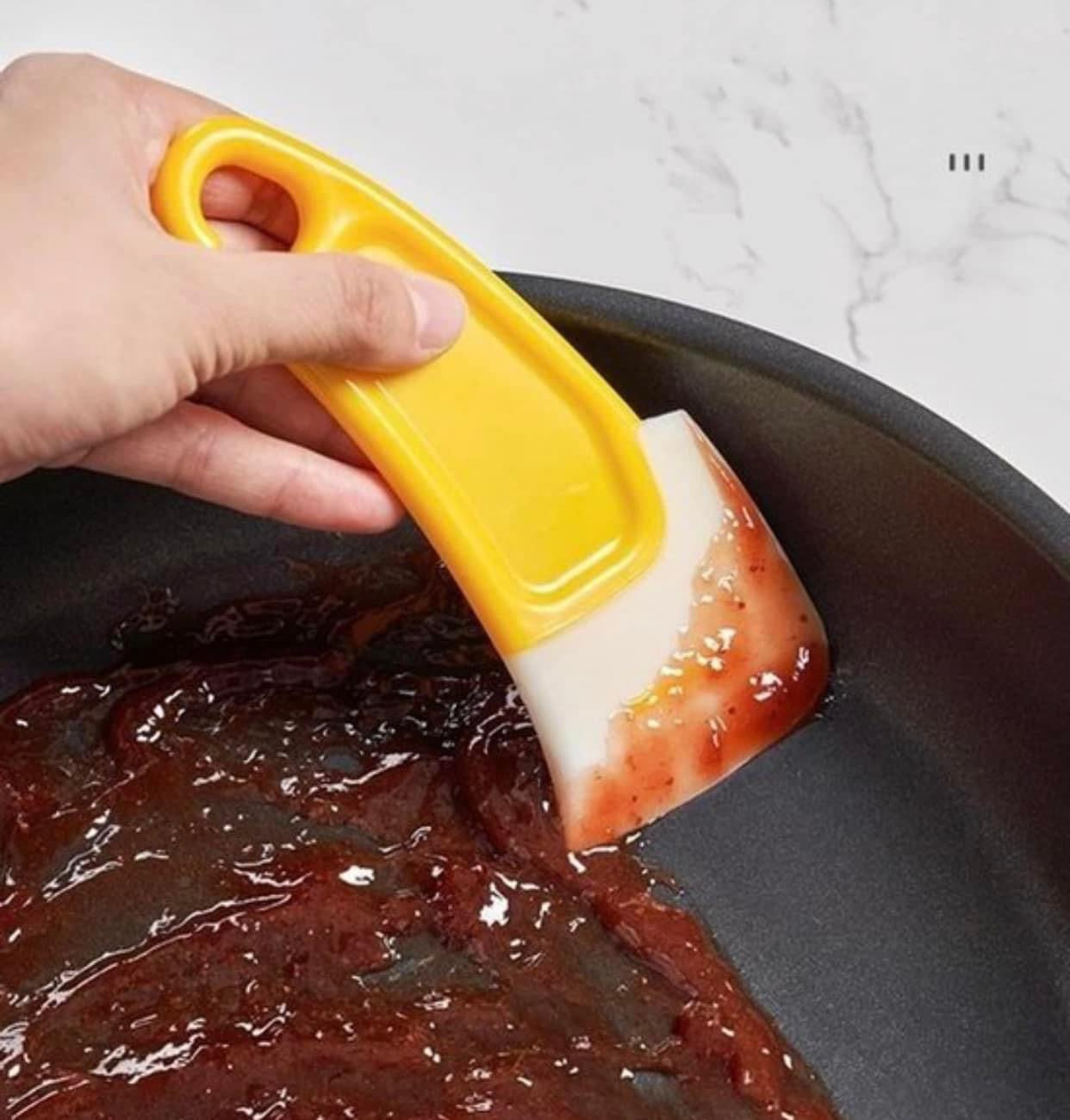 Yellow cooking / cleaning spatula