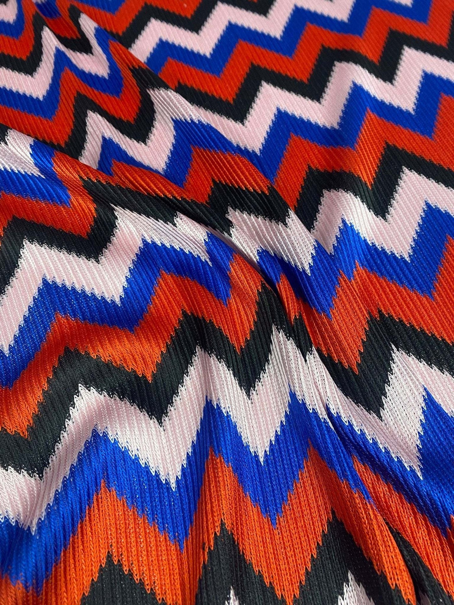 Bold Zigzag Mesh Knit Fabric in Red Blue and Black by the Metre