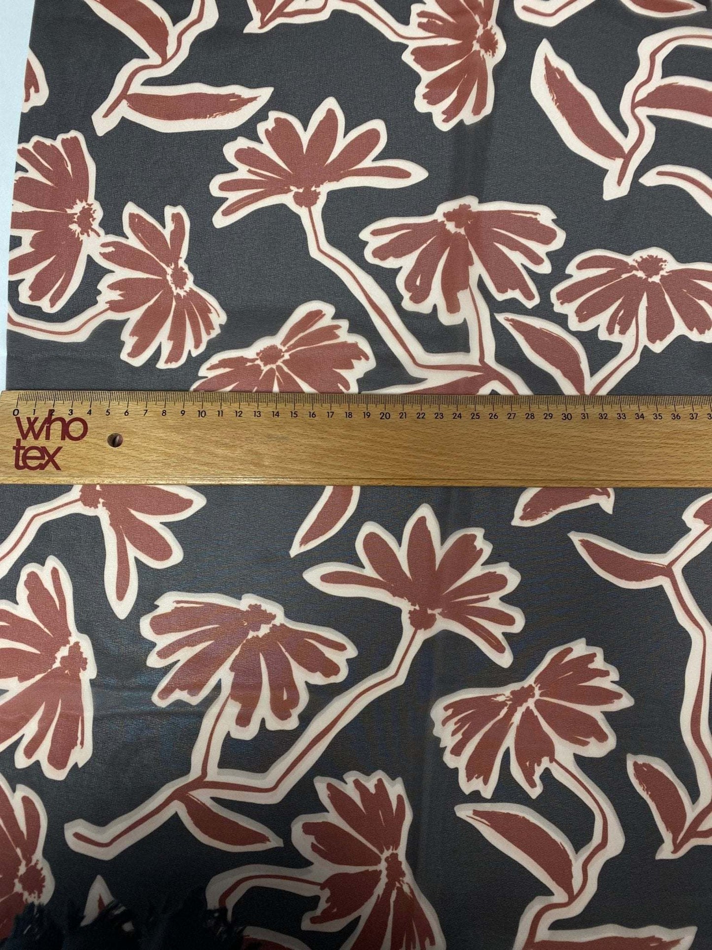 Rust Red Floral Print Fabric on Black Background