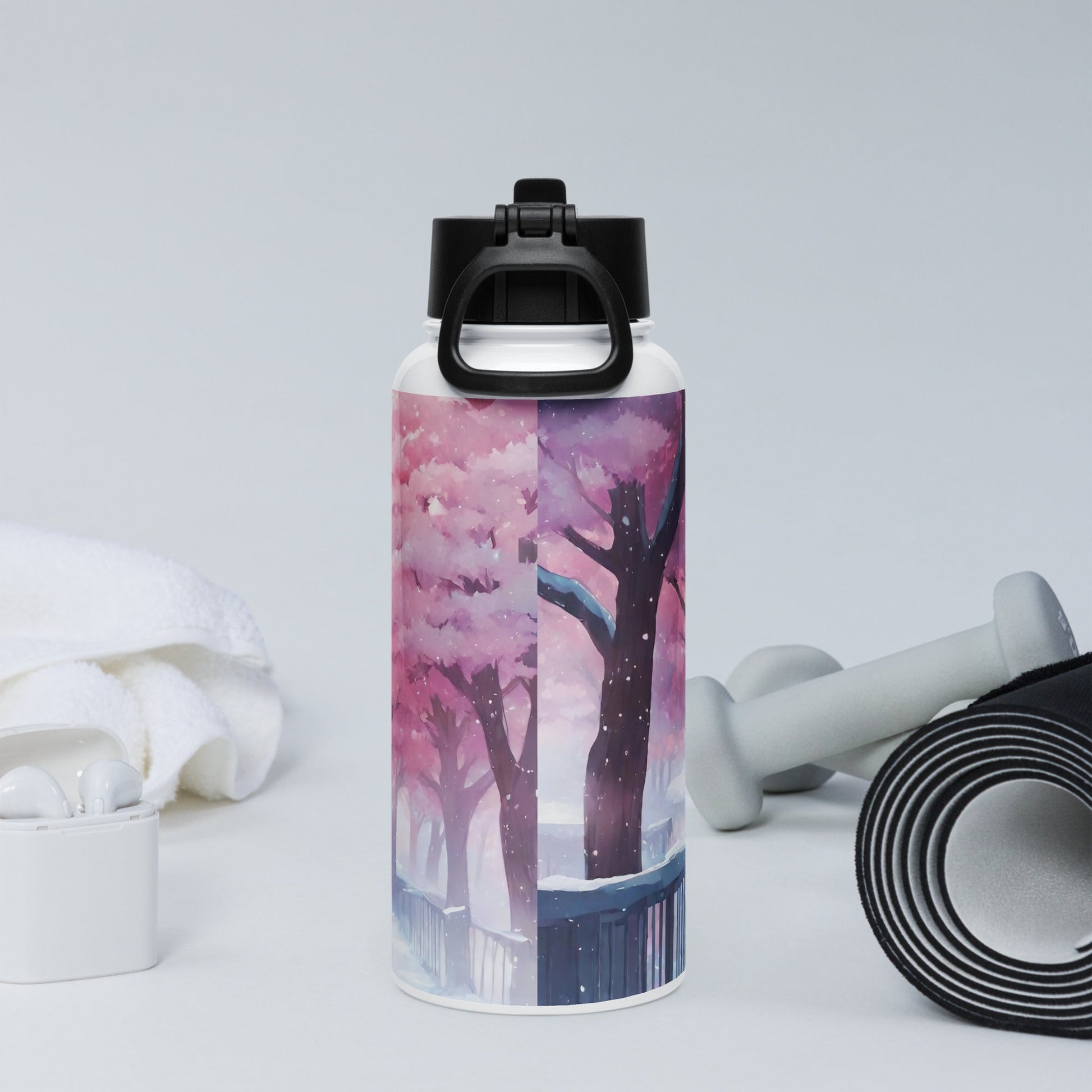 Stainless steel water bottle with a straw lid