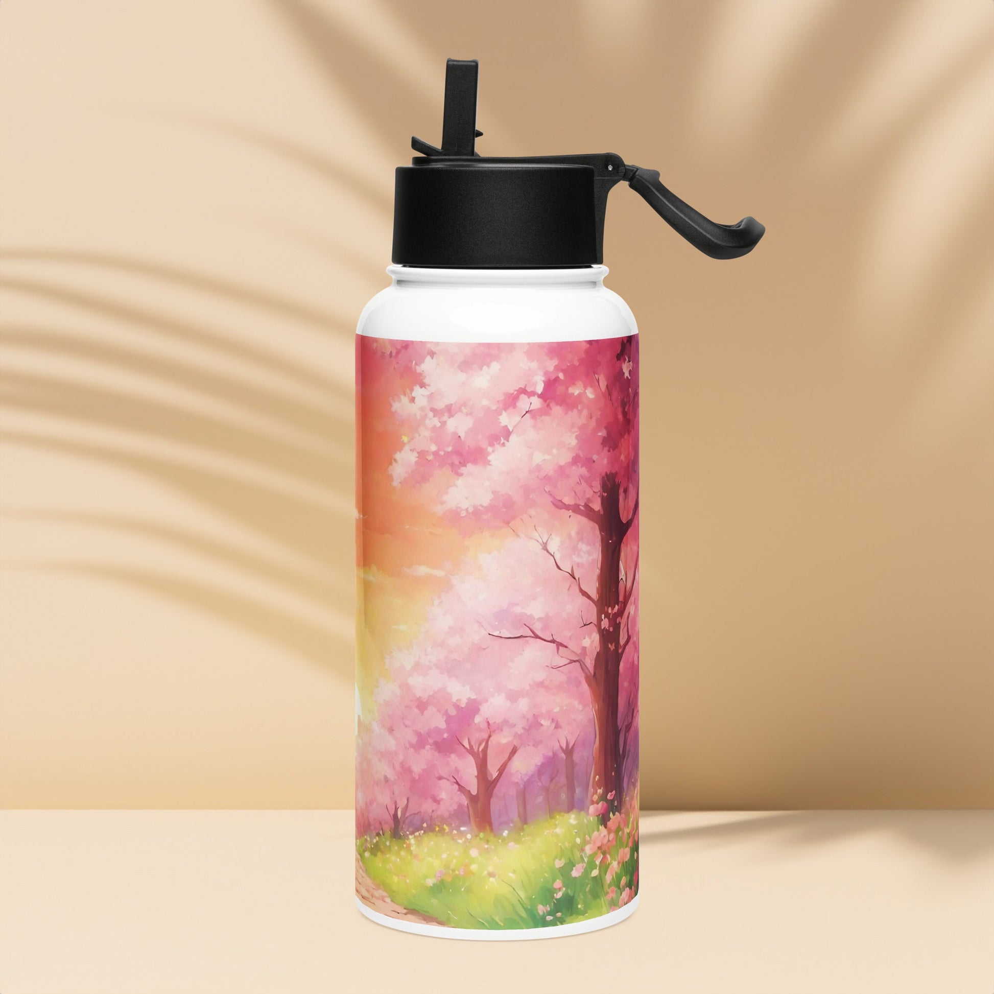 Stainless steel water bottle with a straw lid