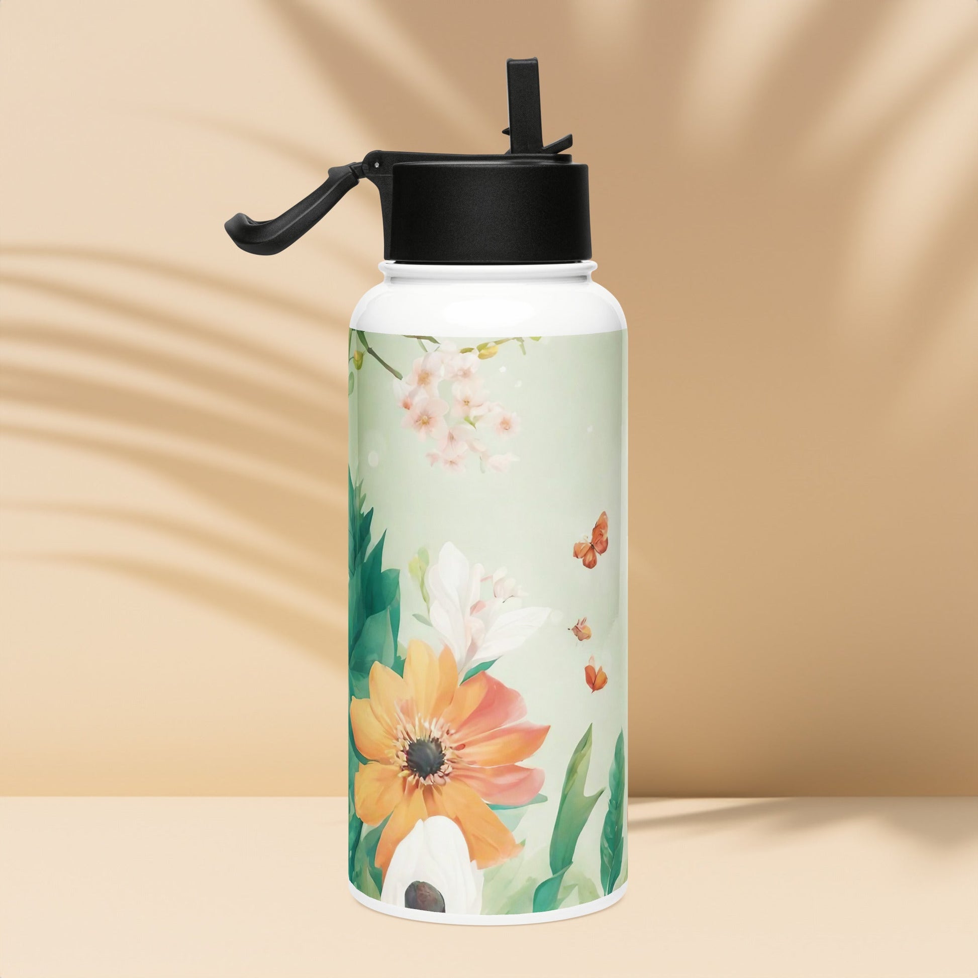 Stainless steel water bottle with a straw lid